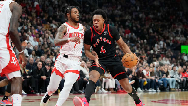 Raptors forward Scottie Barnes (4) drives to the net against Houston Rockets forward Cam Whitmore (7) during the first half at Scotiabank Arena.